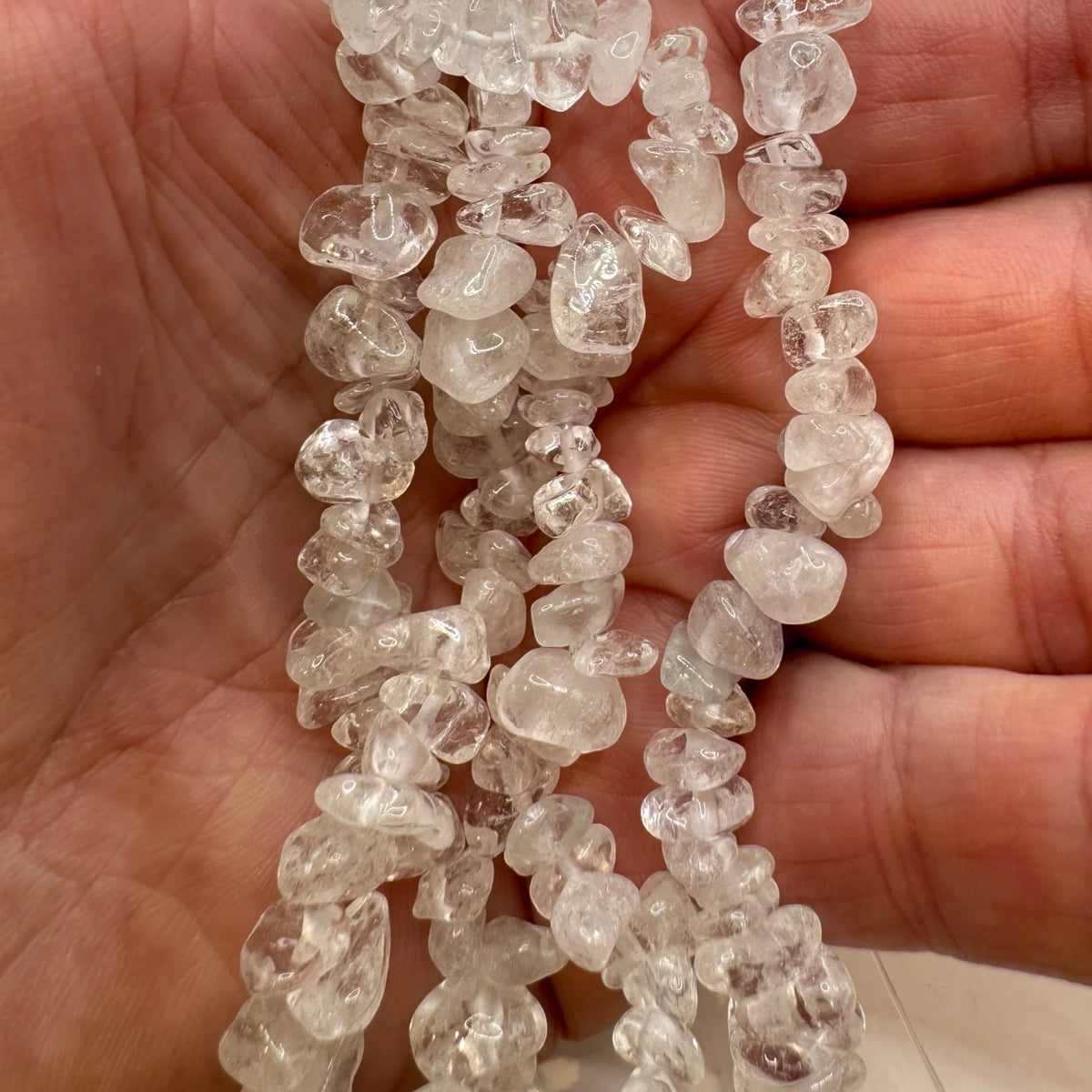 Fil de perles naturelles de Cristal de Roche chips / Baroque 80cm